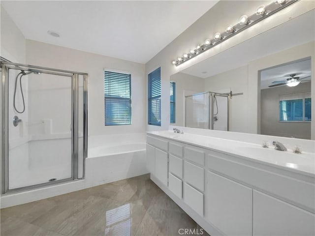 bathroom with ceiling fan, vanity, and independent shower and bath