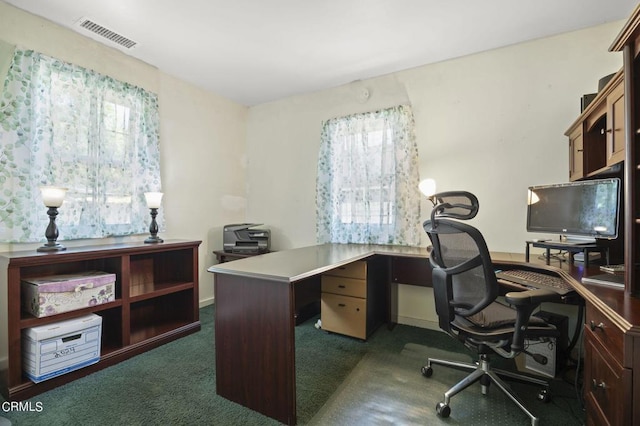 office area featuring visible vents and dark carpet