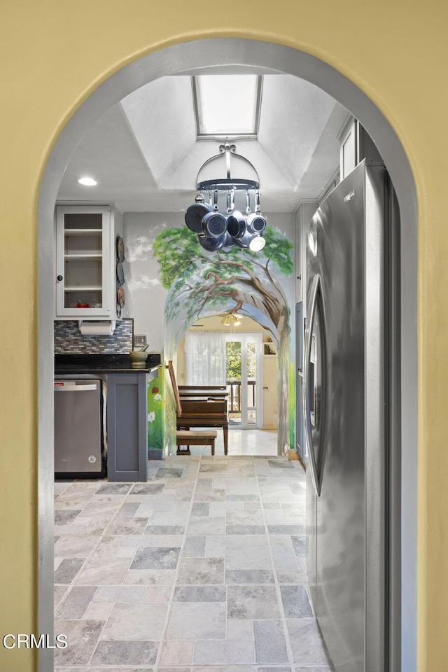 interior space with stone finish floor and recessed lighting