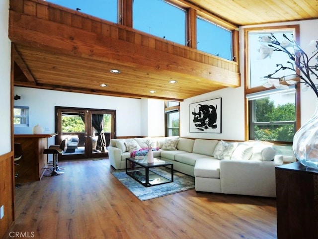 living room with wooden ceiling, wood-type flooring, and french doors