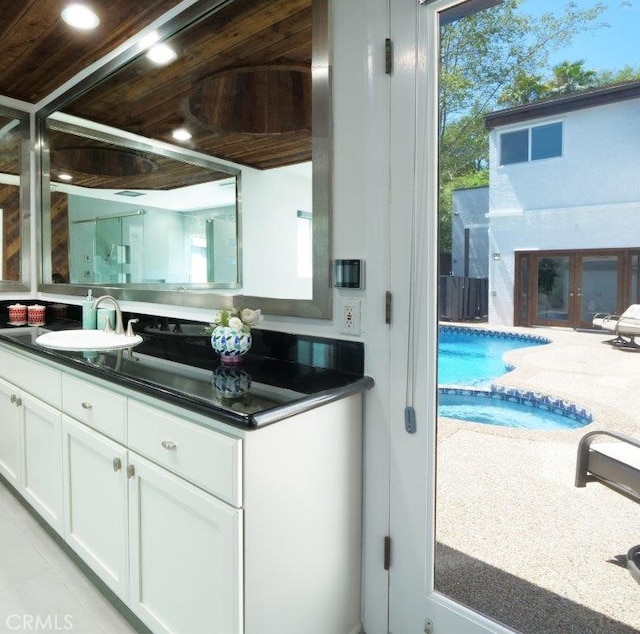 bathroom featuring vanity and wooden ceiling