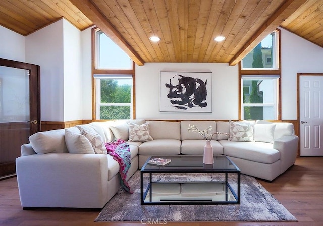 living room with wooden ceiling, wood-type flooring, and vaulted ceiling with beams