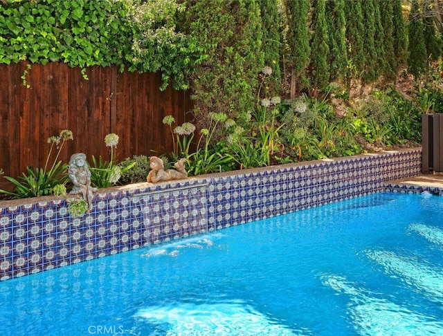 view of pool featuring pool water feature