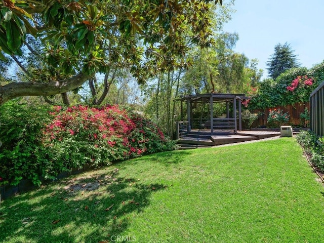 view of yard with a wooden deck