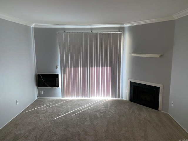 unfurnished living room featuring ornamental molding and carpet floors