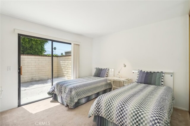 bedroom featuring access to exterior and carpet flooring