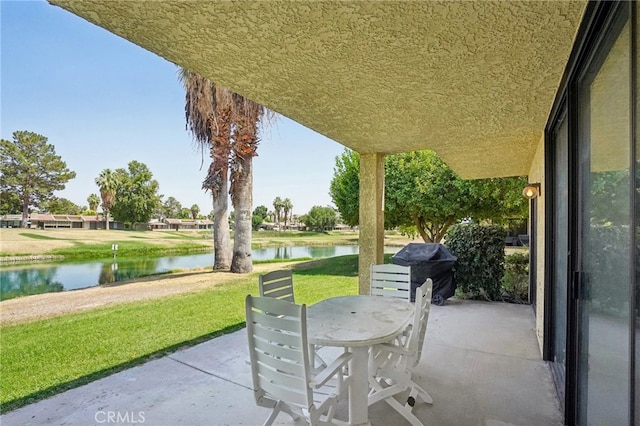 view of patio / terrace with a water view