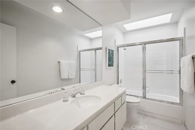 full bathroom featuring vanity, toilet, and enclosed tub / shower combo