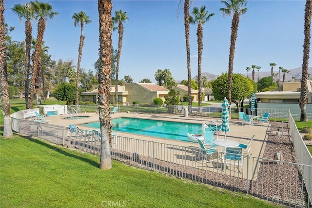 view of pool featuring a yard and a patio area