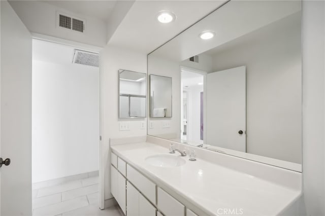 bathroom with vanity and tile patterned floors