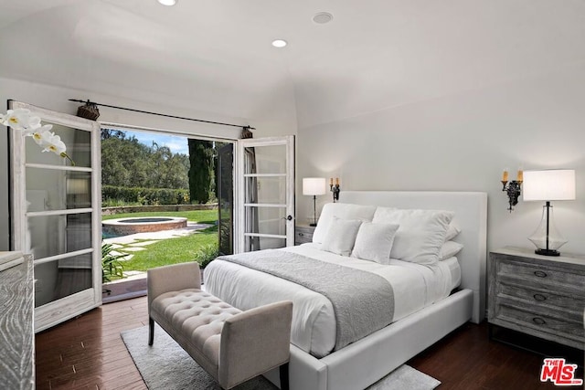 bedroom with access to outside and dark hardwood / wood-style floors