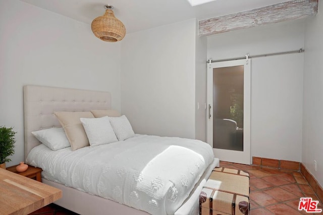 bedroom with a barn door