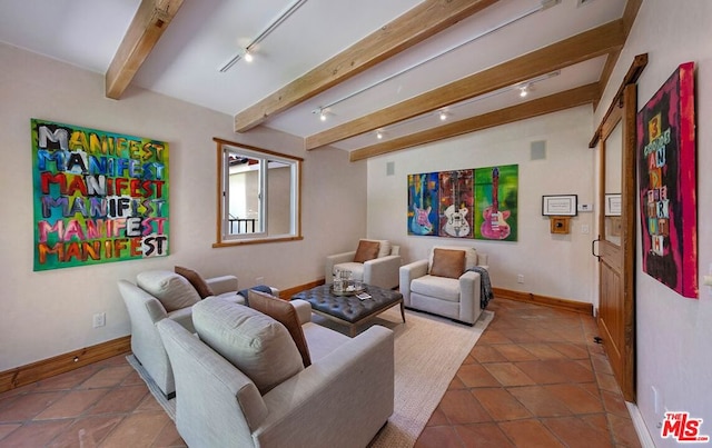 tiled living room featuring beam ceiling and rail lighting