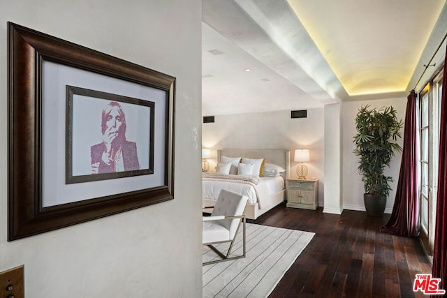 bedroom featuring dark hardwood / wood-style floors