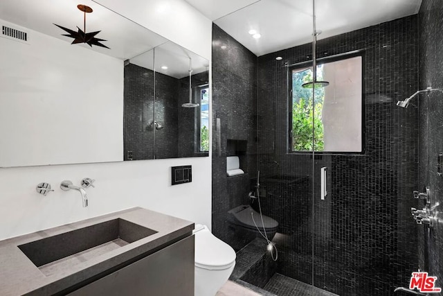 bathroom featuring vanity, toilet, walk in shower, and ceiling fan