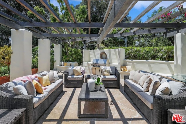 view of patio featuring a pergola, a grill, and an outdoor living space