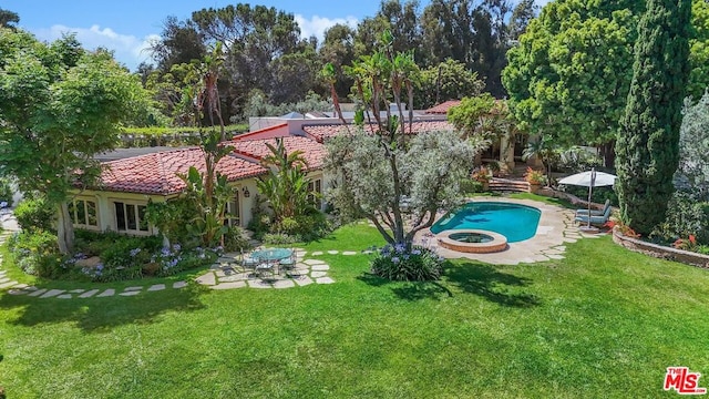 view of swimming pool with a patio and a lawn