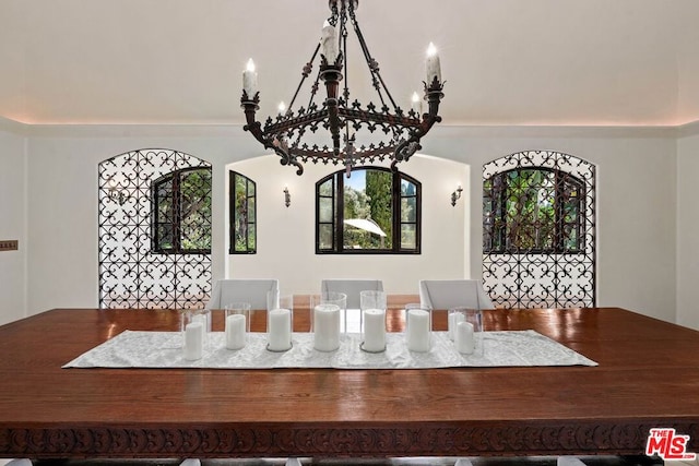 unfurnished dining area featuring an inviting chandelier