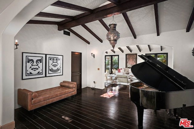 living room with lofted ceiling with beams, wood-type flooring, and french doors