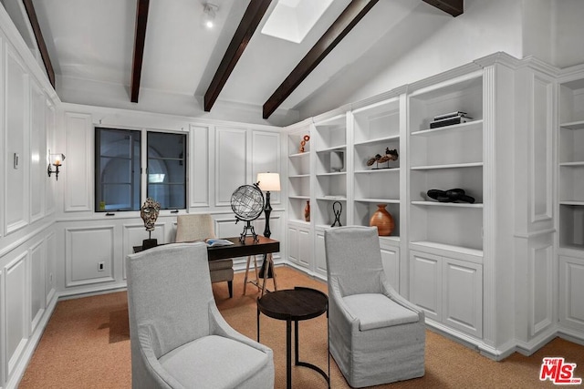 carpeted office space with vaulted ceiling with beams