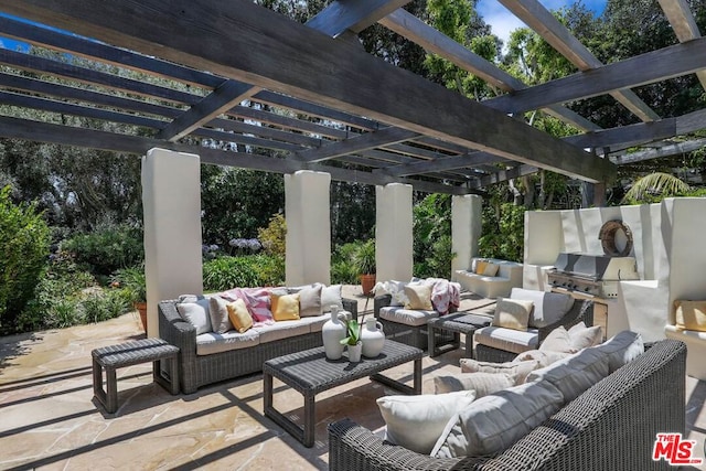 view of patio / terrace featuring outdoor lounge area, exterior kitchen, and a pergola