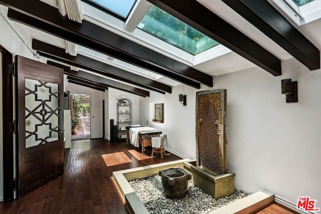 entryway featuring beam ceiling and dark hardwood / wood-style flooring