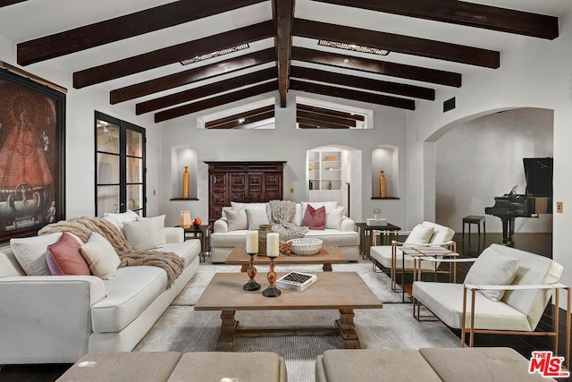 living room featuring lofted ceiling with beams