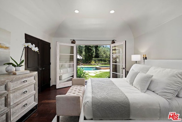 bedroom with dark hardwood / wood-style flooring and vaulted ceiling