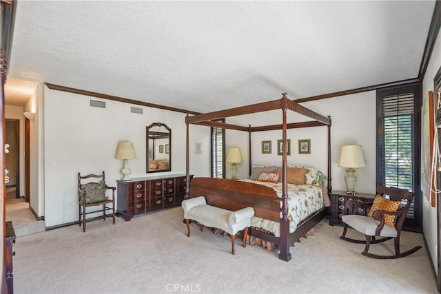 bedroom with light colored carpet, a textured ceiling, and ornamental molding