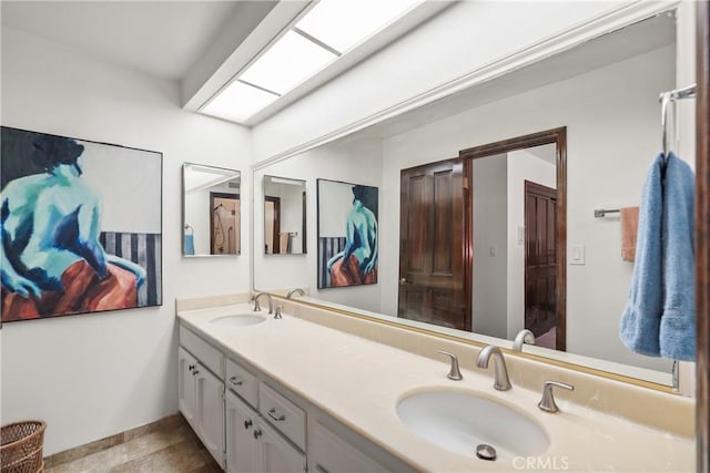 bathroom featuring tile patterned flooring and vanity