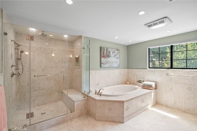 bathroom featuring a stall shower, visible vents, a garden tub, and recessed lighting