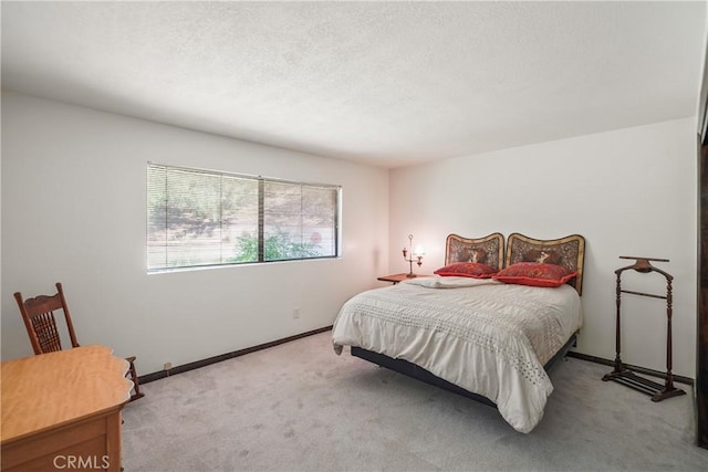 bedroom with light colored carpet