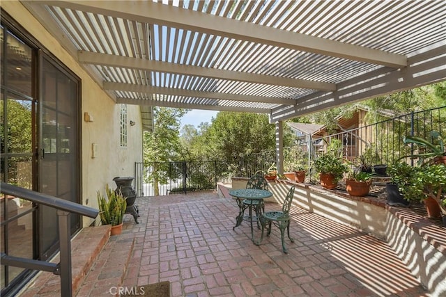 view of patio featuring a pergola