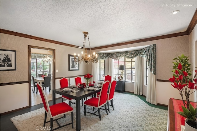 dining room with a healthy amount of sunlight, wallpapered walls, a textured ceiling, and crown molding