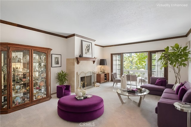 living area featuring crown molding, a fireplace with raised hearth, a textured ceiling, and light colored carpet