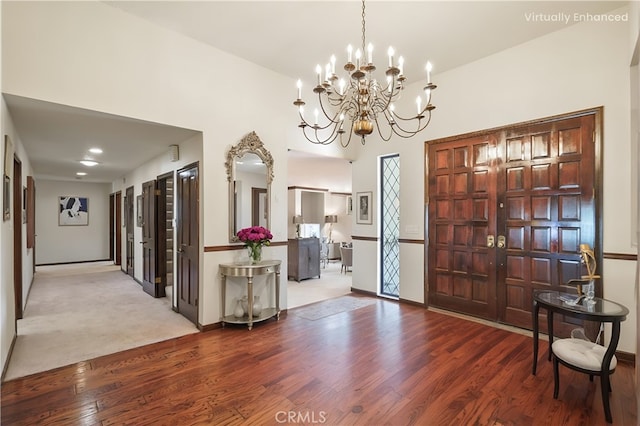 foyer entrance featuring wood finished floors and baseboards