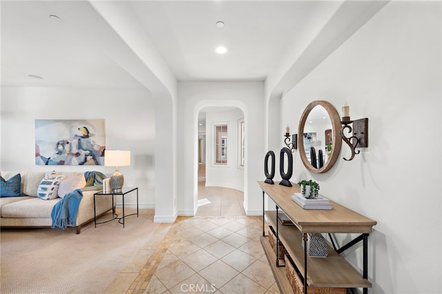 hallway featuring light tile patterned floors