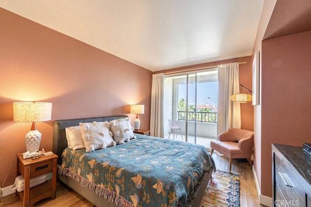 850 E Ocean Blvd Unit 613, Long Beach, CA 90802 - bedroom featuring light wood-style flooring and access to exterior