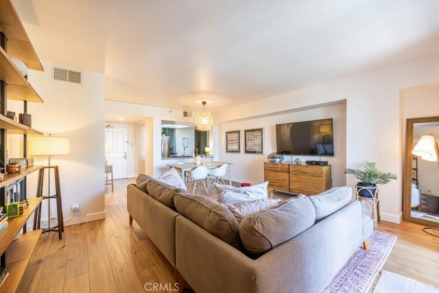 850 E Ocean Blvd Unit 613, Long Beach, CA 90802 - living room with light wood-type flooring and baseboards