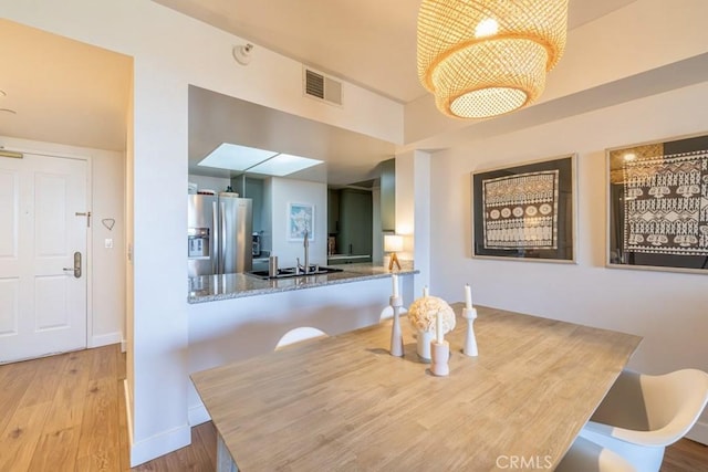 850 E Ocean Blvd Unit 613, Long Beach, CA 90802 - dining room with wood finished floors and baseboards