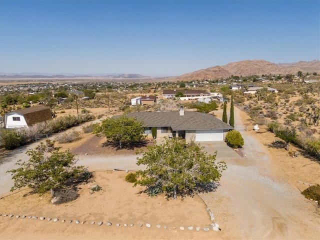 birds eye view of property with a mountain view