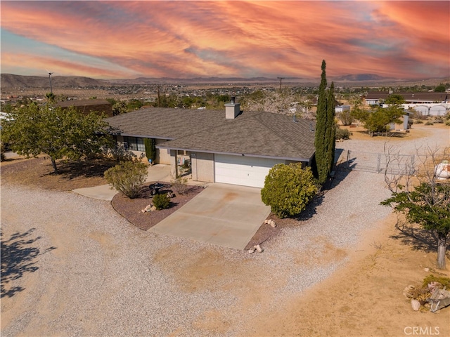 ranch-style house featuring a garage