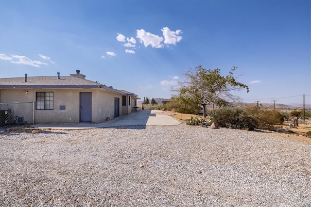 rear view of property featuring a patio