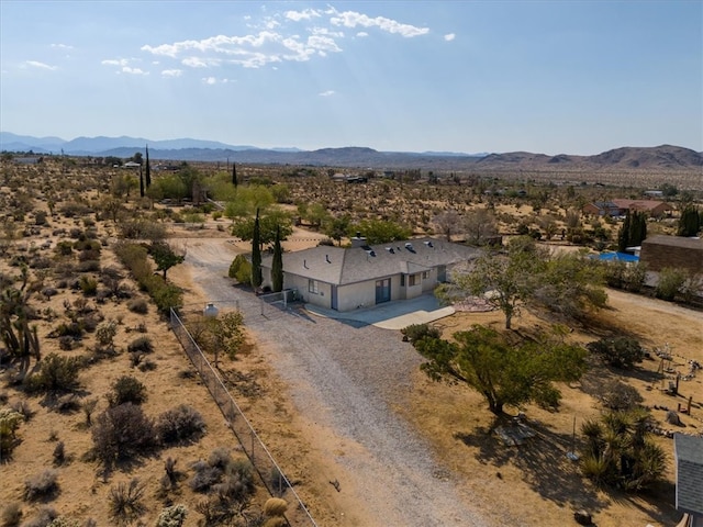 birds eye view of property featuring a mountain view