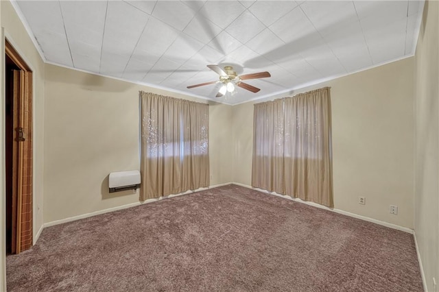 spare room featuring carpet, heating unit, and ceiling fan