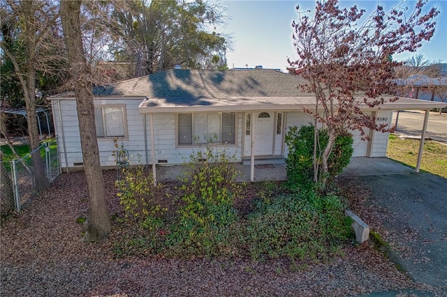 single story home with a garage and a carport