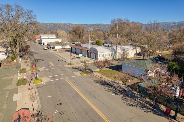 birds eye view of property featuring a mountain view