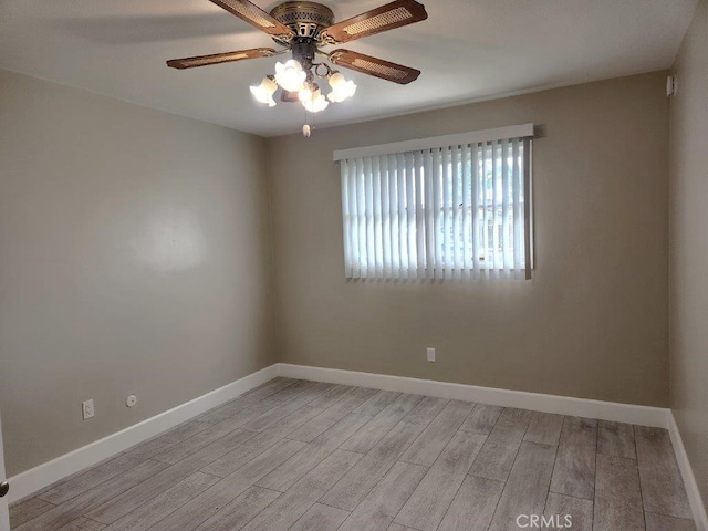 spare room featuring ceiling fan and light hardwood / wood-style floors