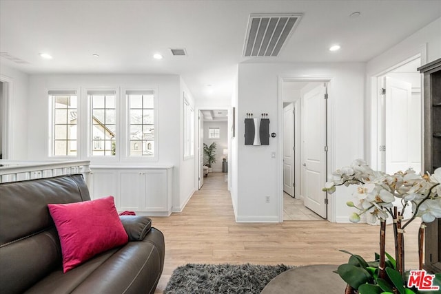 living room with light hardwood / wood-style floors