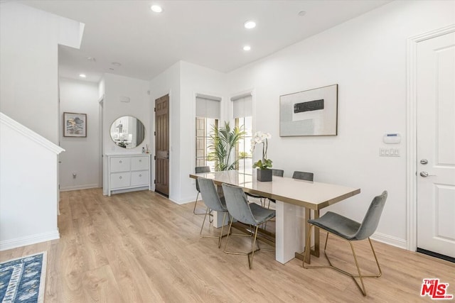 dining space with light wood-type flooring